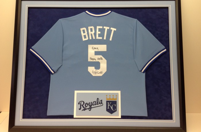 George Brett jersey framed with Kansas City Royals logo
